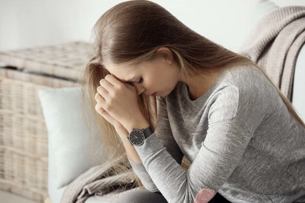 woman thinking about drug overdose symptoms